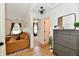 Bright entryway with wood flooring, a dresser with mirror, and a view into the living room at 6556 Wandering Way, Indianapolis, IN 46241