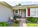 Quaint front entrance with seating, potted plants, and an inviting walkway to the front door at 6556 Wandering Way, Indianapolis, IN 46241