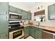 Well-equipped kitchen with stainless steel appliances, modern cabinetry, and butcher block countertops at 6556 Wandering Way, Indianapolis, IN 46241