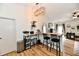Stylish kitchen bar area with seating, modern lighting, and easy access to living spaces at 6556 Wandering Way, Indianapolis, IN 46241