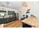 Modern kitchen featuring updated cabinets, stainless steel appliances, and stylish lighting at 6556 Wandering Way, Indianapolis, IN 46241