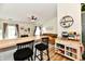 Bright living room and kitchen featuring an inviting open layout, perfect for modern living at 6556 Wandering Way, Indianapolis, IN 46241