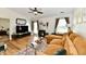 Comfortable living room featuring hardwood floors, a cozy sofa, and ample natural light at 6556 Wandering Way, Indianapolis, IN 46241