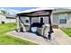Relaxing covered patio with outdoor seating and stylish decor, perfect for entertaining guests at 6556 Wandering Way, Indianapolis, IN 46241
