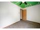 Bedroom featuring green ceiling with white football field design, window and door at 6715 Wandering Way, Indianapolis, IN 46241