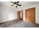 Bedroom with neutral carpet, a ceiling fan, and a closet at 6715 Wandering Way, Indianapolis, IN 46241