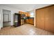 This kitchen has tile floors, stainless steel appliances, wood cabinets, and a closet at 6715 Wandering Way, Indianapolis, IN 46241