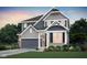 Beautiful two-story home with gray siding, stone accents, a covered porch, and well-manicured landscaping at 6833 Jacone Dr, Brownsburg, IN 46112