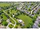 Expansive aerial view of a neighborhood with large green spaces and mature trees, blending rural and residential living at 7056 E 171St St, Noblesville, IN 46062