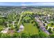 Impressive aerial shot reveals the spacious lots, lush greenery, and peaceful setting of the neighborhood at 7056 E 171St St, Noblesville, IN 46062
