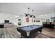 Entertainer's basement features a billiards table, a stylish bar, and ample lounge seating at 7056 E 171St St, Noblesville, IN 46062