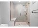 Elegant bathroom with tiled shower featuring a bench, rainfall showerhead, and glass door at 7056 E 171St St, Noblesville, IN 46062
