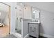 Modern bathroom featuring a glass-enclosed shower, updated vanity, and modern fixtures at 7056 E 171St St, Noblesville, IN 46062