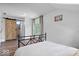 Bright bedroom features a barn door, white walls, and large windows providing natural light at 7056 E 171St St, Noblesville, IN 46062
