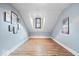 Spacious bonus room featuring a vaulted ceiling, wood laminate flooring, and a bright window seat at 7056 E 171St St, Noblesville, IN 46062