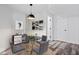 Dining room featuring modern decor, wood floors, and a glass top table with seating at 7056 E 171St St, Noblesville, IN 46062