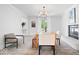 Spacious dining area with a fireplace, wood floors, and ample natural light at 7056 E 171St St, Noblesville, IN 46062