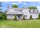 Two-story home with well-manicured landscaping, a covered porch, and beautiful curb appeal at 7056 E 171St St, Noblesville, IN 46062