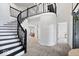Bright foyer with a curved staircase, wood floors, and neutral walls at 7056 E 171St St, Noblesville, IN 46062