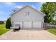 Detached three car garage offering ample space for vehicles and storage, plus plenty of parking at 7056 E 171St St, Noblesville, IN 46062