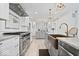 Spacious kitchen featuring an oven range, granite countertops and a farmhouse sink at 7056 E 171St St, Noblesville, IN 46062