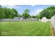 Expansive backyard featuring a well-maintained lawn, wooden fence, and a storage shed at 7242 Blue Ridge Dr, Noblesville, IN 46062