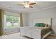 Bedroom featuring a bright window with a view of the backyard and a queen sized bed at 7242 Blue Ridge Dr, Noblesville, IN 46062