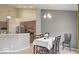 Elegant dining room with a chandelier and a large table for Gathering gatherings next to the kitchen at 7242 Blue Ridge Dr, Noblesville, IN 46062