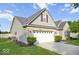 Charming single-Gathering home with well-maintained lawn, mature trees, and a two-car garage at 7242 Blue Ridge Dr, Noblesville, IN 46062