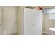 Laundry room space with ample storage, a large cabinet, and a bright window at 7242 Blue Ridge Dr, Noblesville, IN 46062