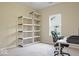 Bright office space with a window, a desk, and shelving for ample storage at 7242 Blue Ridge Dr, Noblesville, IN 46062