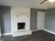 Living room with whitewashed brick fireplace and vinyl plank flooring at 732 W 700 N, Fortville, IN 46040