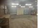 Spacious garage featuring concrete floors, overhead lighting, and ample storage and workspace at 732 W 700 N, Fortville, IN 46040
