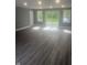 Spacious living room with lots of natural light and vinyl floors at 732 W 700 N, Fortville, IN 46040