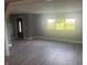Living room with luxury vinyl floors and a large window at 732 W 700 N, Fortville, IN 46040