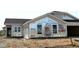 View of a house under construction with visible weather barriers and windows at 7338 Broadview Ln, McCordsville, IN 46055