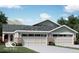 Charming single-story home with a brick facade, gray roof, and a two-car garage, offering comfortable suburban living at 7338 Broadview Ln, McCordsville, IN 46055