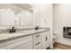 Modern bathroom featuring double sinks, granite countertops, white cabinets, and stylish black fixtures at 747 Tuxedo Dr, Westfield, IN 46074