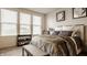 Comfortable bedroom featuring a cozy bed, neutral decor, and plenty of natural light from large windows at 747 Tuxedo Dr, Westfield, IN 46074