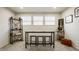 Modern dining area with a sleek table, stools, and ample natural light, perfect for entertaining at 747 Tuxedo Dr, Westfield, IN 46074
