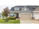 Charming home featuring neutral siding, an attached garage, and a welcoming front porch at 747 Tuxedo Dr, Westfield, IN 46074