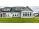 Exterior back view of a home with many windows and green grass lawn at 747 Tuxedo Dr, Westfield, IN 46074