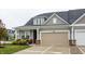 Attractive home with neutral-colored siding, an attached garage, and a charming front sitting area at 747 Tuxedo Dr, Westfield, IN 46074