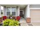 Inviting front porch with outdoor seating, decorative plants, and a welcoming front door at 747 Tuxedo Dr, Westfield, IN 46074