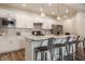 Modern kitchen features white cabinetry, stainless steel appliances, and a breakfast bar at 747 Tuxedo Dr, Westfield, IN 46074