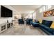 Bright open-concept living room with modern furniture, stylish decor, and large windows at 747 Tuxedo Dr, Westfield, IN 46074