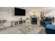 Cozy living room featuring blue accent chairs, a modern entertainment center, and stylish decor at 747 Tuxedo Dr, Westfield, IN 46074