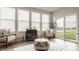 Bright sunroom with modern furniture, large windows overlooking backyard at 747 Tuxedo Dr, Westfield, IN 46074