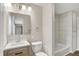 Bathroom featuring a modern vanity, tiled shower, and a neutral color scheme at 7625 E 35Th St, Indianapolis, IN 46226