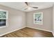 This bedroom has two windows, light colored walls, and laminate flooring at 7625 E 35Th St, Indianapolis, IN 46226